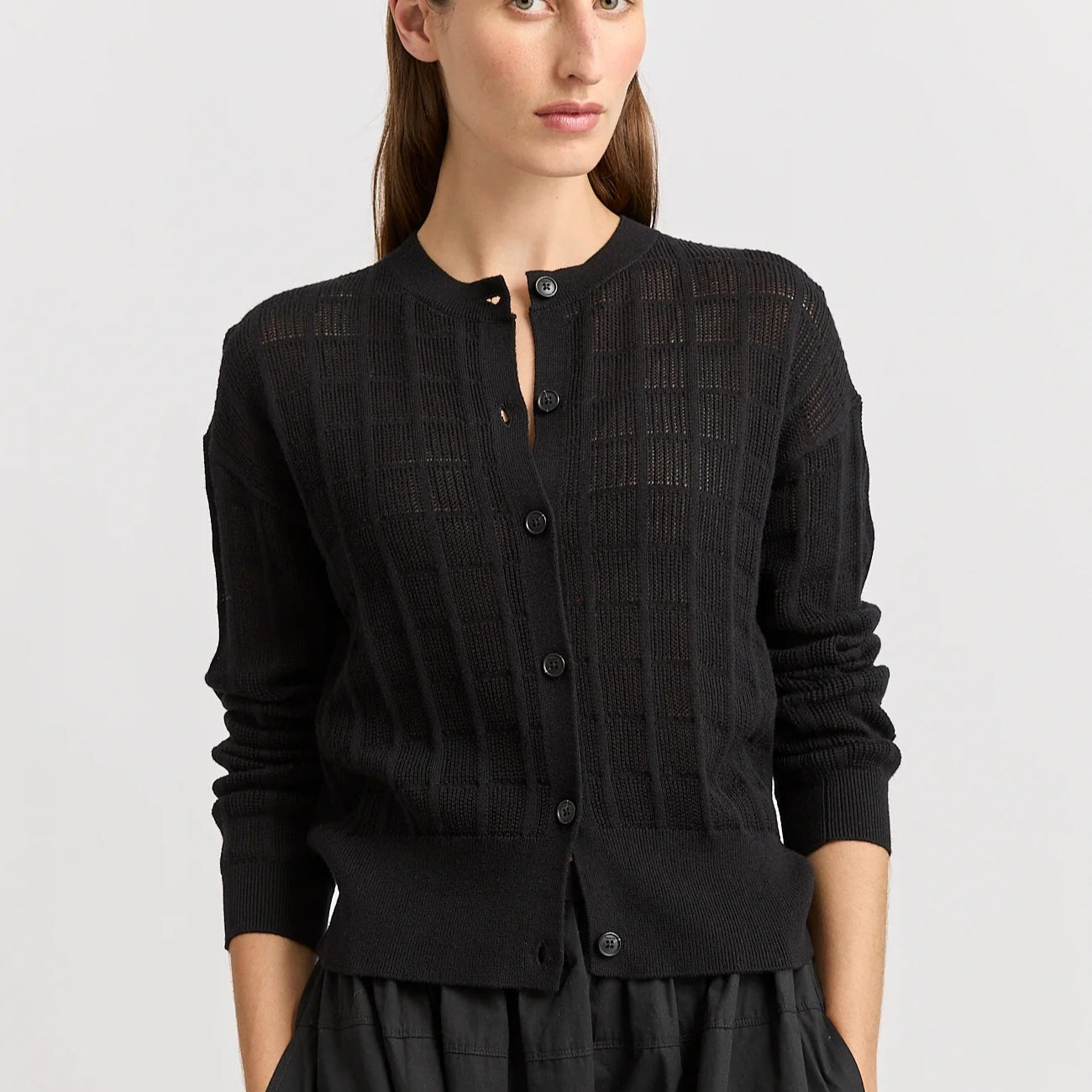 Woman wearing Toorallie's Open Stitch merino cotton Cardigan in Black