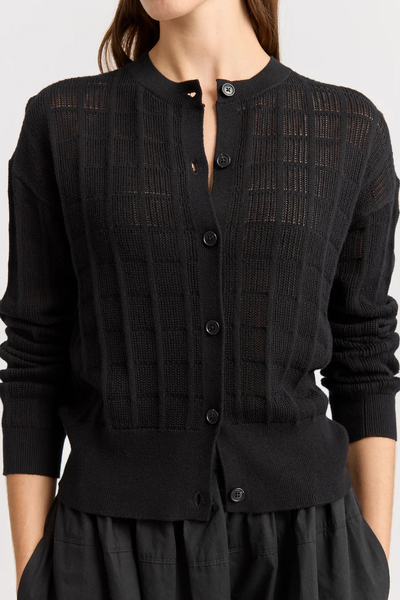 Woman wearing Toorallie's Open Stitch merino cotton Cardigan in Black