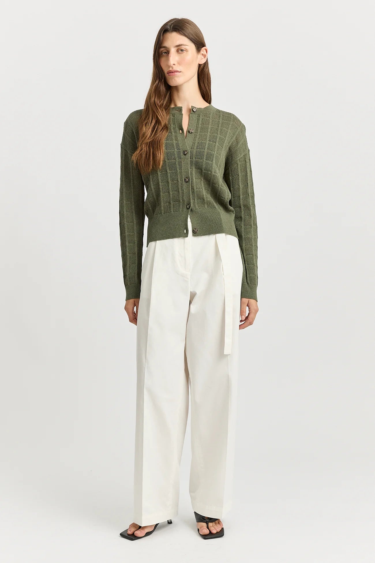 Woman wearing Toorallie's Open Stitch merino cotton Cardigan in Olive green