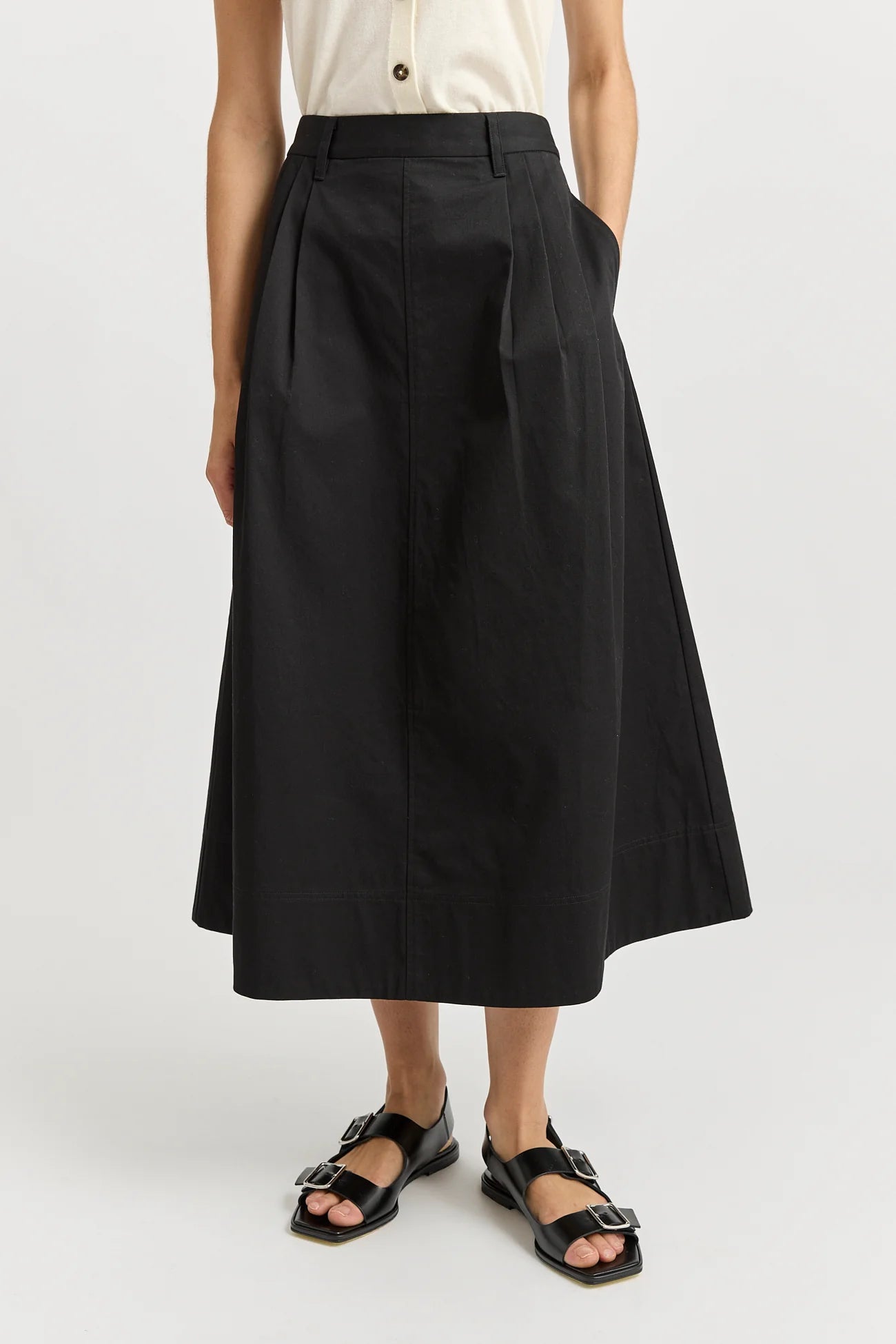 Woman wearing Toorallie's Pleat Detail cotton midi skirt in black