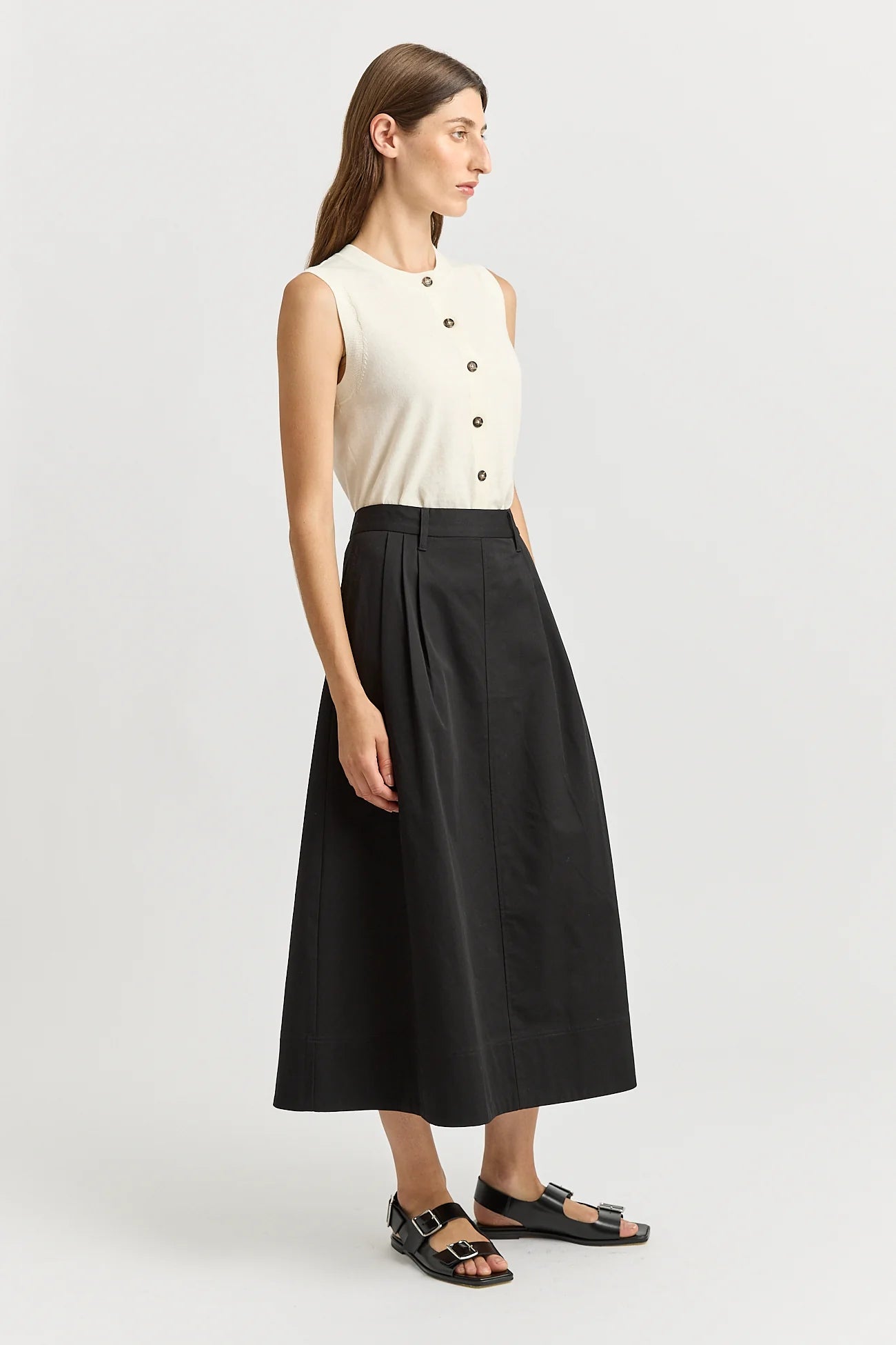 Woman wearing Toorallie's Pleat Detail cotton midi skirt in black