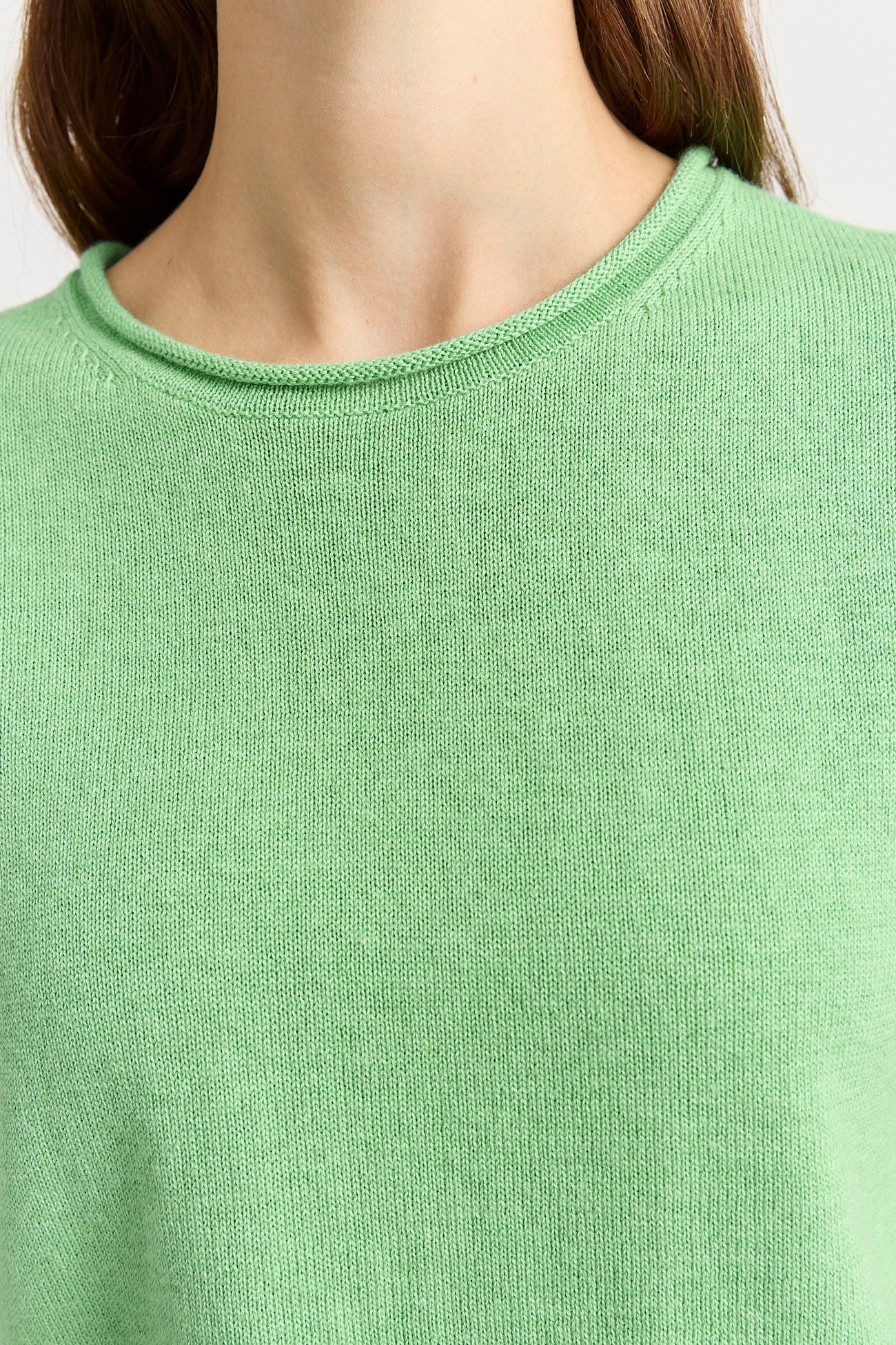 Woman wearing Toorallie's Short Sleeve Knit cotton merino top in Agave green