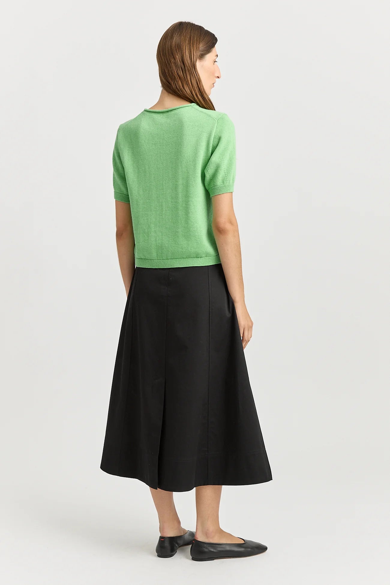 Woman wearing Toorallie's Short Sleeve Knit cotton merino top in Agave green