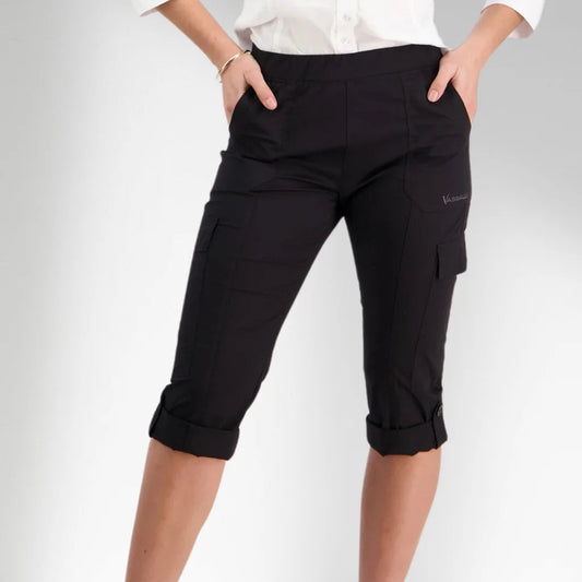 Woman wearing pull on cargo pants in black by vassalli capri length