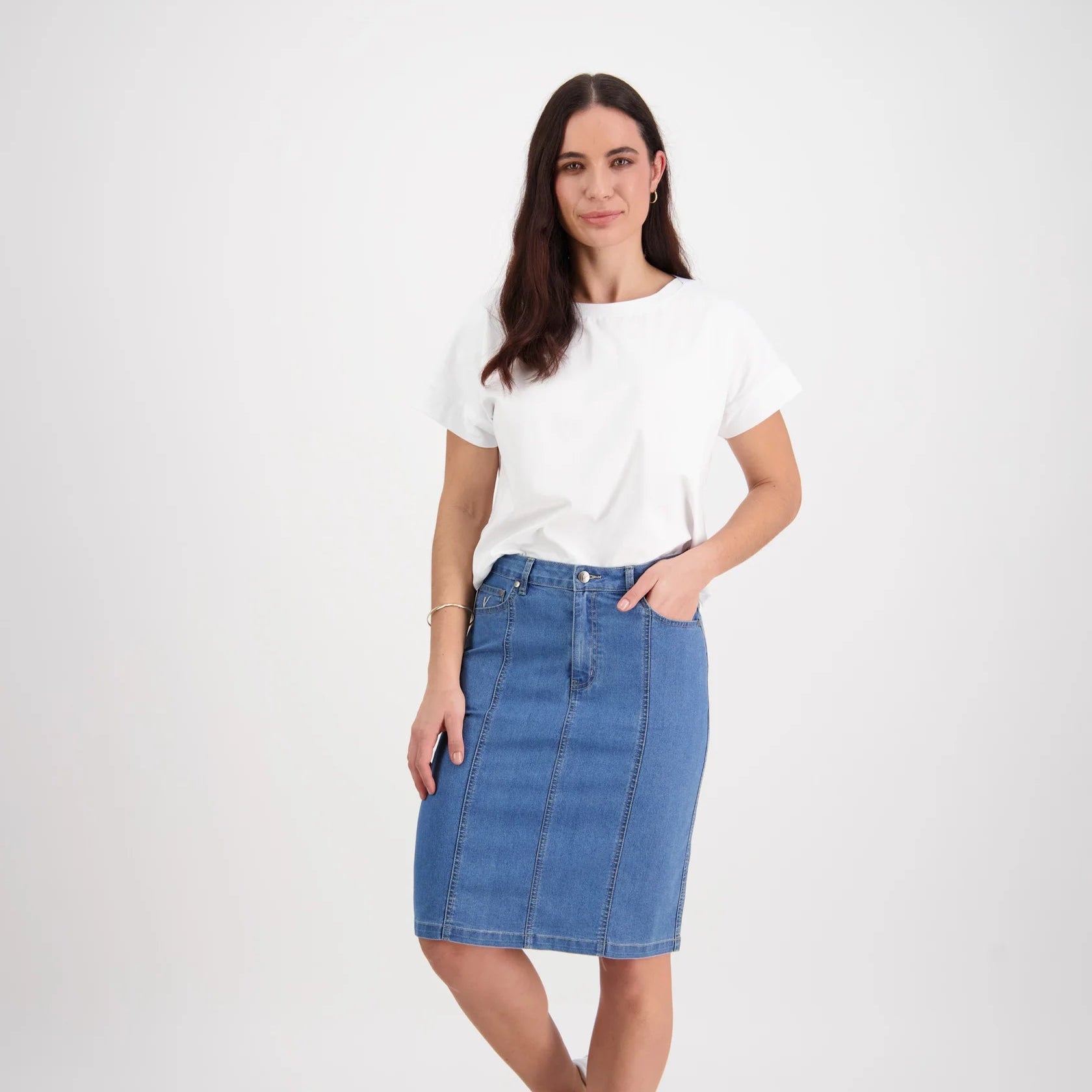 Woman wearing the denim skirt with contrasting cotton stitching by Vassalli in light blue