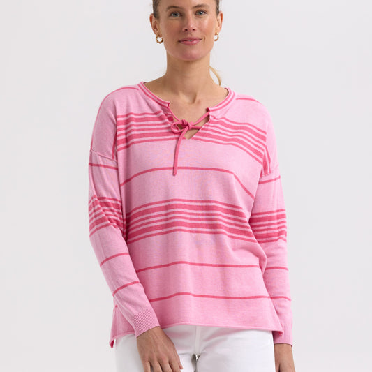 Woman wearing the Beach Bum stripey Jumper by Zaket and Plover in Fondant pink