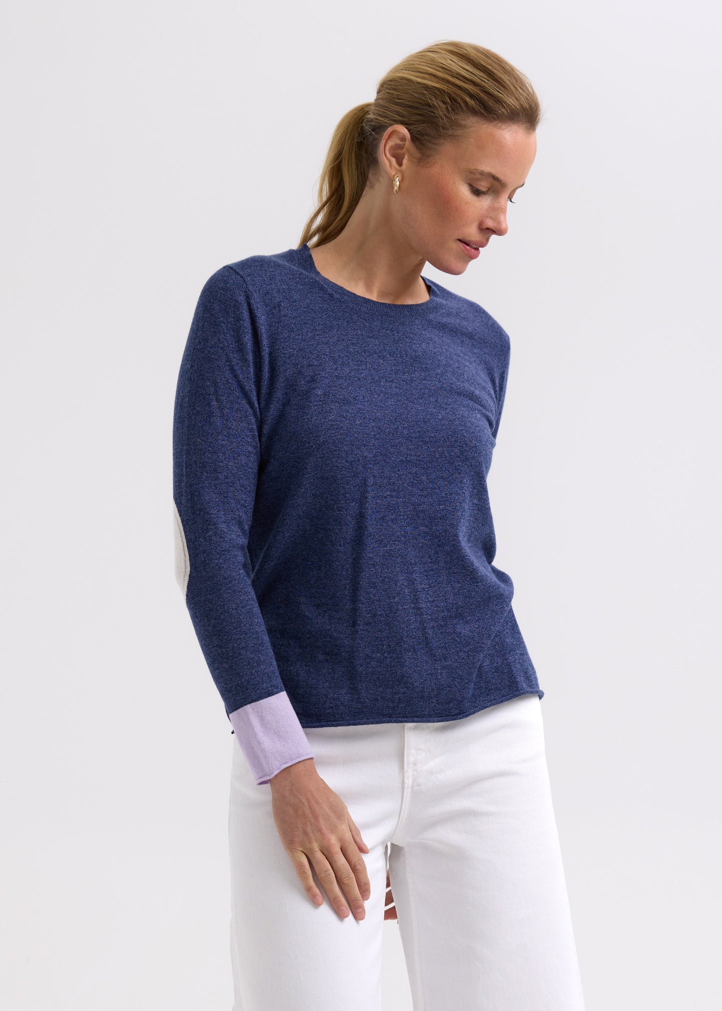 Woman wearing the Elbow Patch Jumper by Zaket and Plover in Denim navy