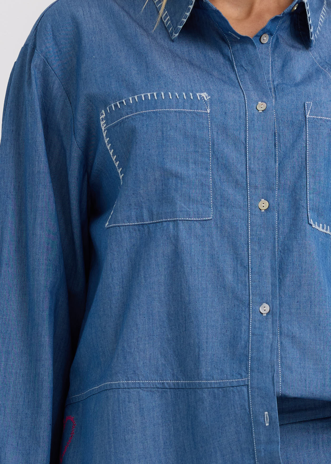 Woman wearing the Hand Work embroidered Denim Shirt by Zaket and Plover
