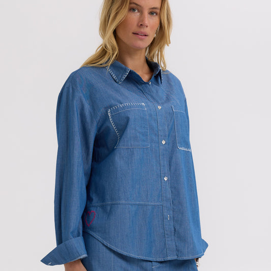 Woman wearing the Hand Work embroidered Denim Shirt by Zaket and Plover