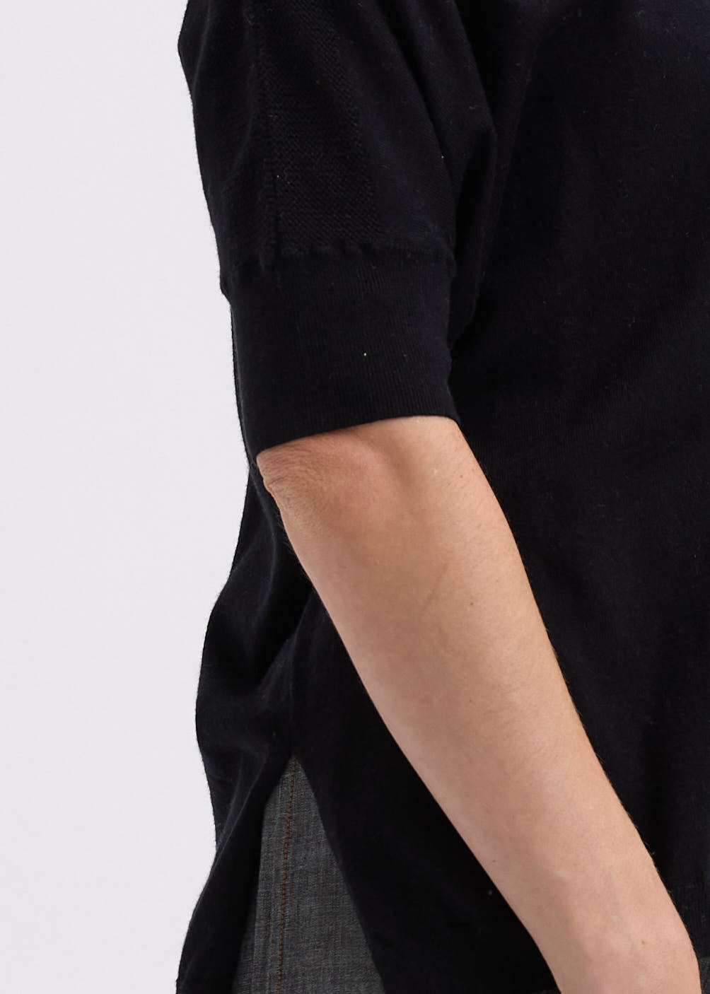 Woman wearing the Pointelle Shoulder Top by Zaket and Plover in black