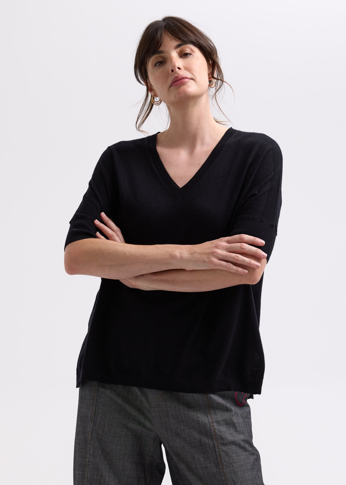 Woman wearing the Pointelle Shoulder Top by Zaket and Plover in black