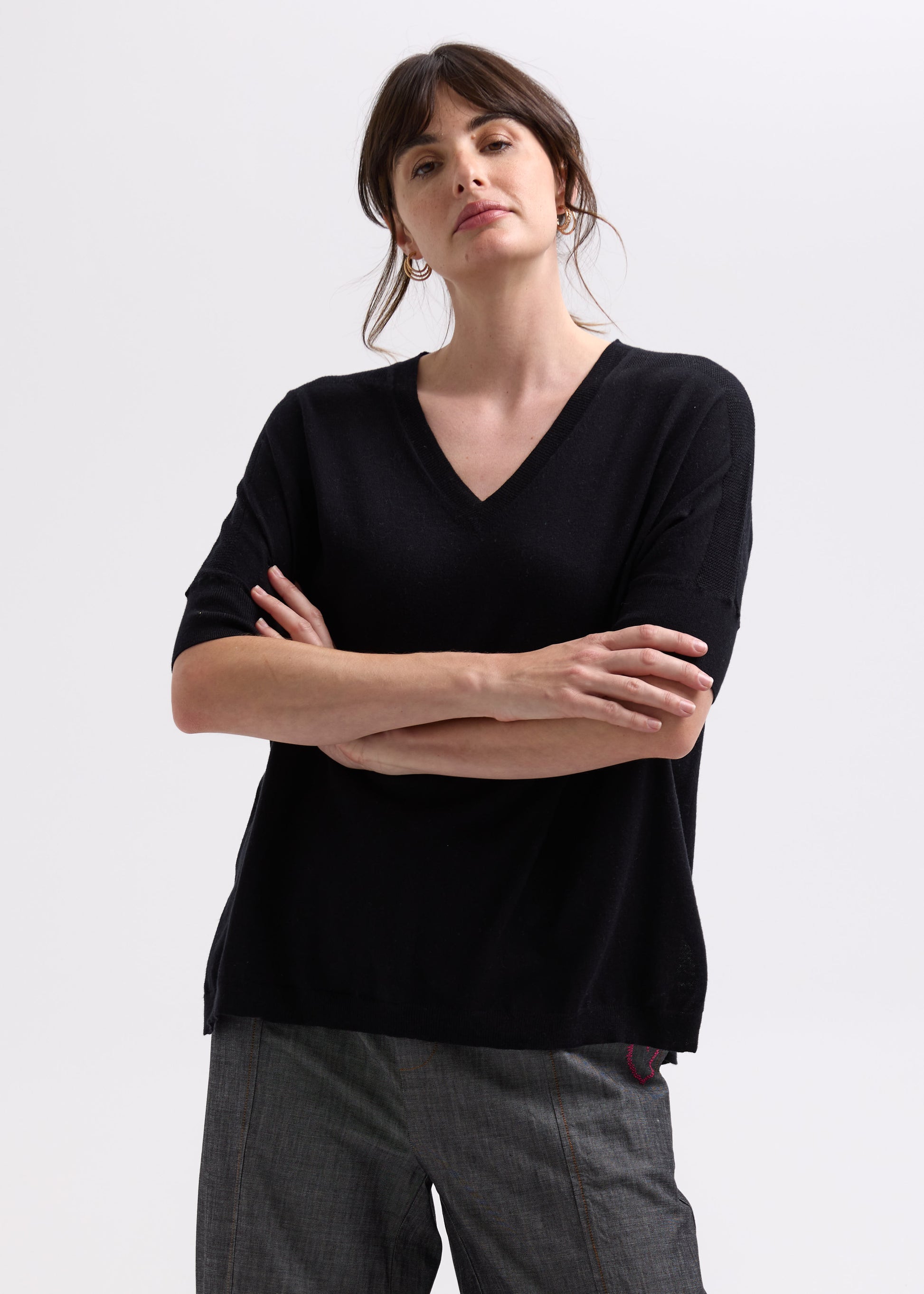 Woman wearing the Pointelle Shoulder Top by Zaket and Plover in black