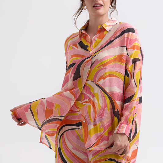 Woman wearing the Summer Shirt with matching Summer Pants by Zaket and Plover in Sunset orange