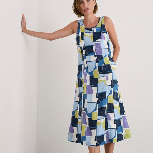 Woman wearing the Sleeveless cotton Grass Wave Dress in Block Shapes by SEASALT