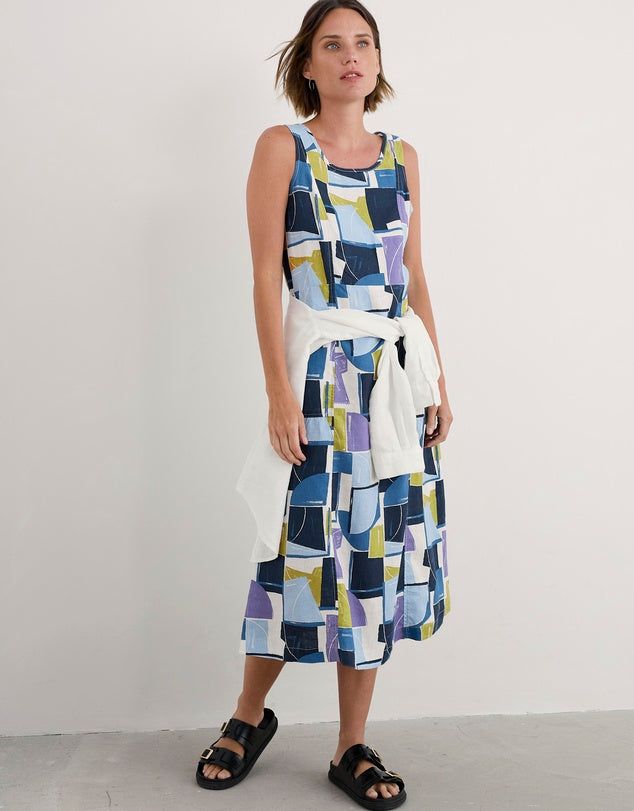Woman wearing the Sleeveless cotton Grass Wave Dress in Block Shapes by SEASALT