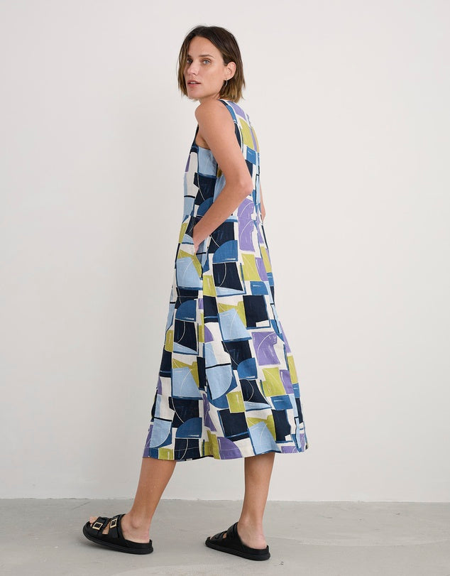 Woman wearing the Sleeveless cotton Grass Wave Dress in Block Shapes by SEASALT