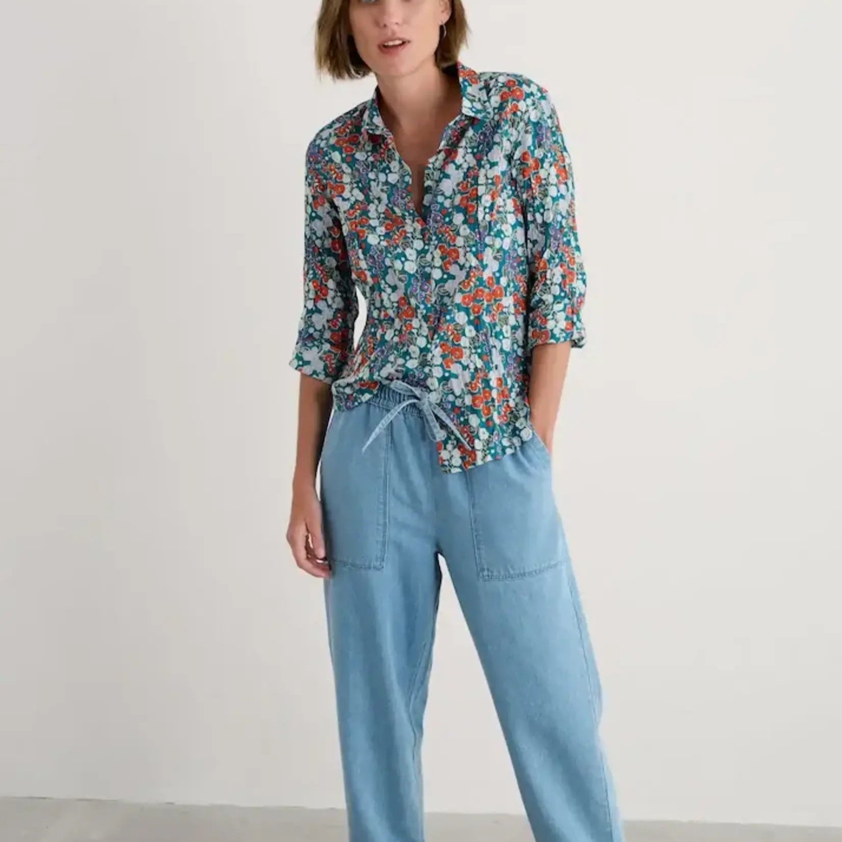 Woman wearing the Larissa cotton Shirt by SEASALT in Wild Hollyhock print