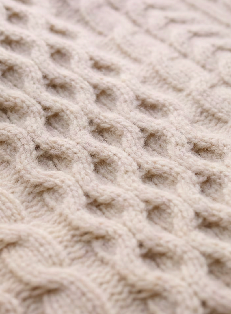 Close up of cable knit in SEASALT's Pine Forest Jumper in Aran