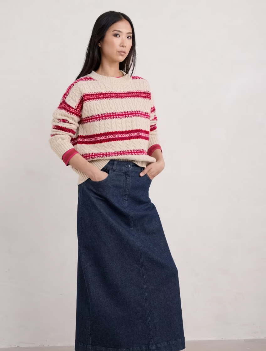 SEASALT's Shepherd Cable Knit Jumper in  Snowflake Crimson Mix with denim skirt