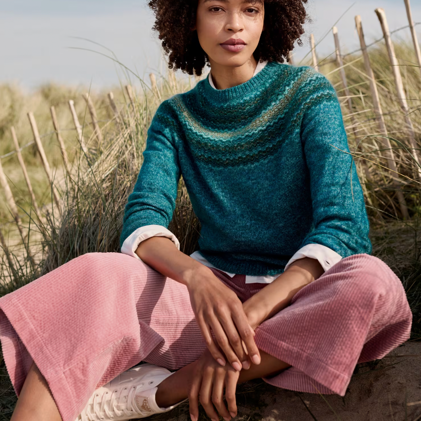 Spruce Frost Jumper - Swirling Lake Mix, woman wearing a jumper by the beach