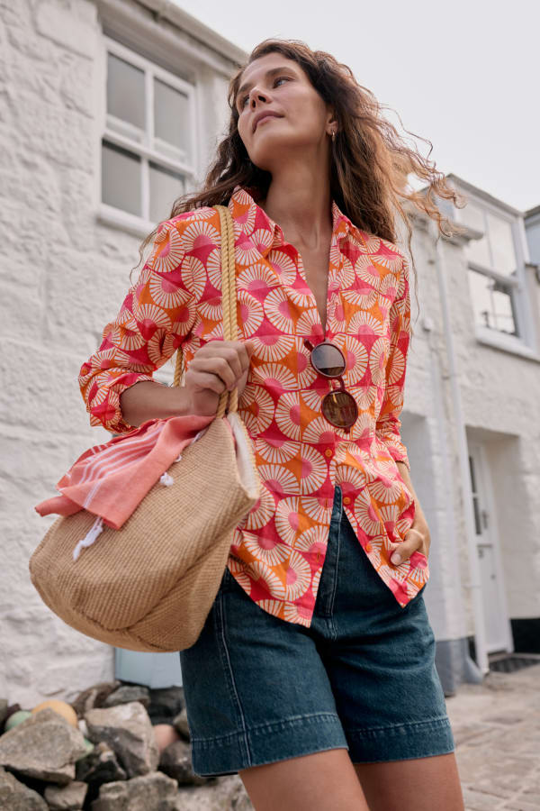 Woman wearing the Larissa Shirt by SEASALT in Geo Marigold