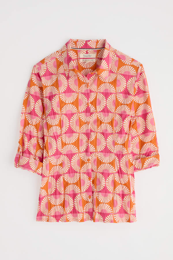 Flat lay of the Larissa Shirt by SEASALT in Geo Marigold pink