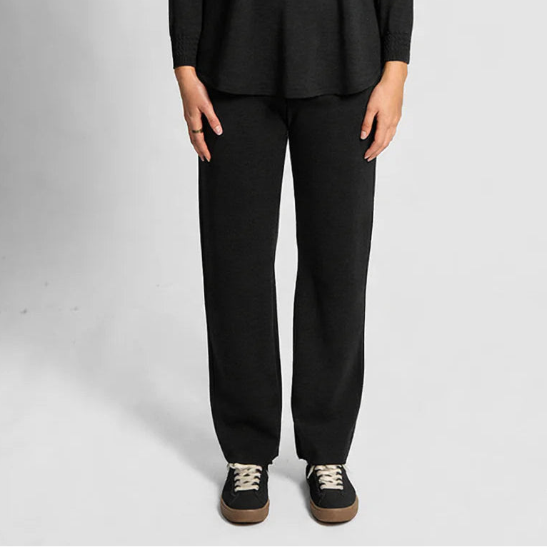Woman wearing the Merino wool Milano pants by Bridge and Lord in Black