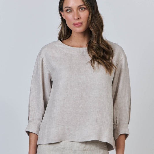 Woman wearing the linen round neck top by Naturals by OJ in Dune beige