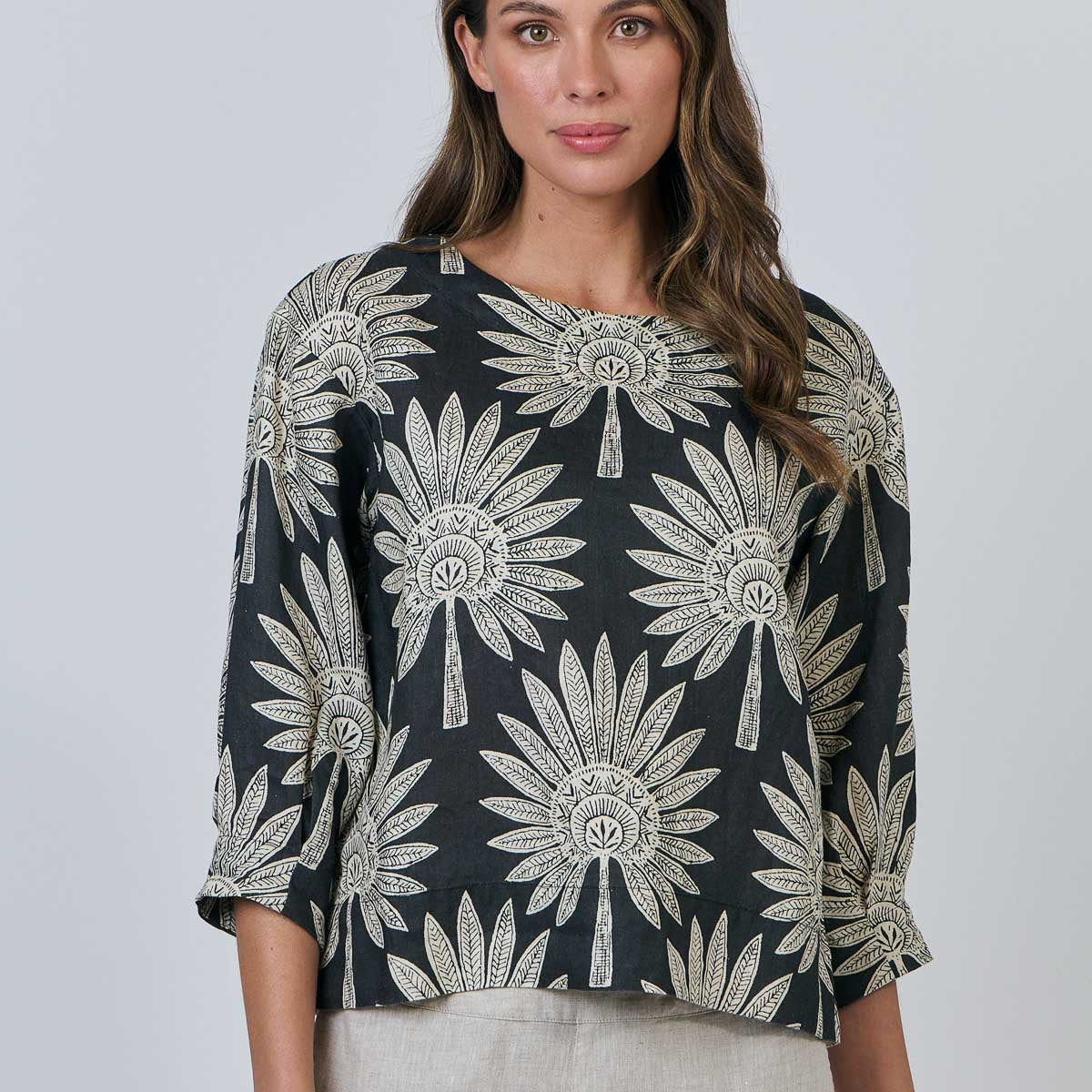 Woman wearing the round neck top by Naturals by OJ in date palm