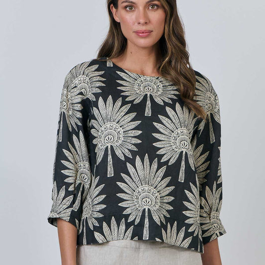 Woman wearing the round neck top by Naturals by OJ in date palm