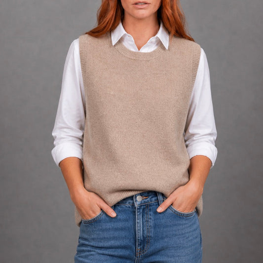Woman wearing the crew neck brown vest by Bridge and Lord in Cobblestone