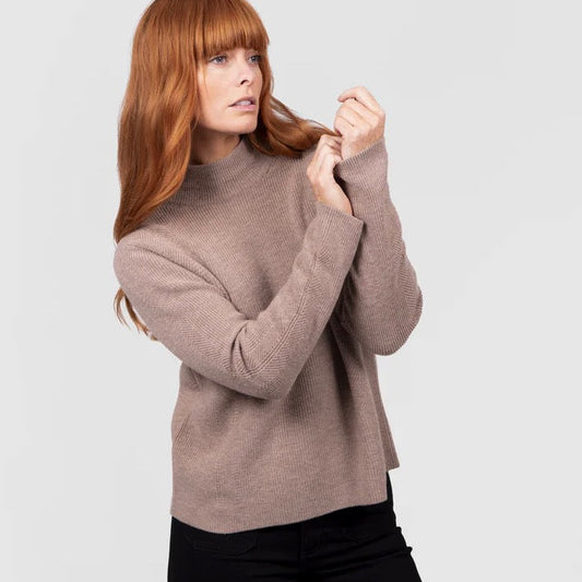 Woman wearing a High crew ribbed brown jumper by Bridge and Lord in Cobblestone