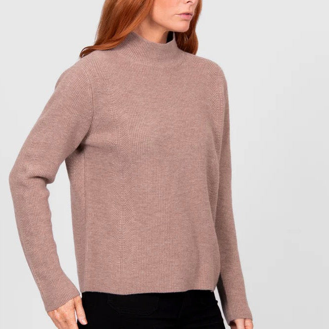 Woman wearing a High crew ribbed brown jumper by Bridge and Lord in Cobblestone