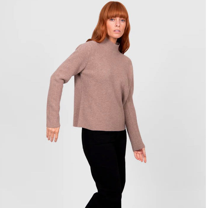 Woman wearing a High crew ribbed brown jumper by Bridge and Lord in Cobblestone