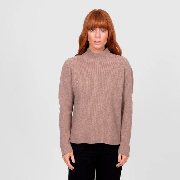 Woman wearing a High crew ribbed brown jumper by Bridge and Lord in Cobblestone
