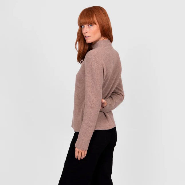 Woman wearing a High crew ribbed brown jumper by Bridge and Lord in Cobblestone