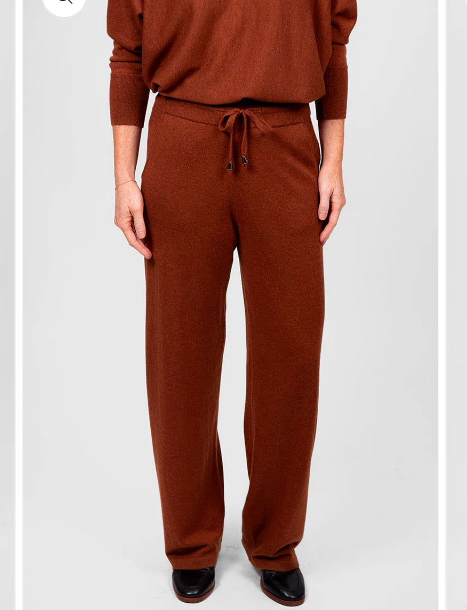 Woman wearing the Bridge and Lord relaxed wide leg pants in cognac brown