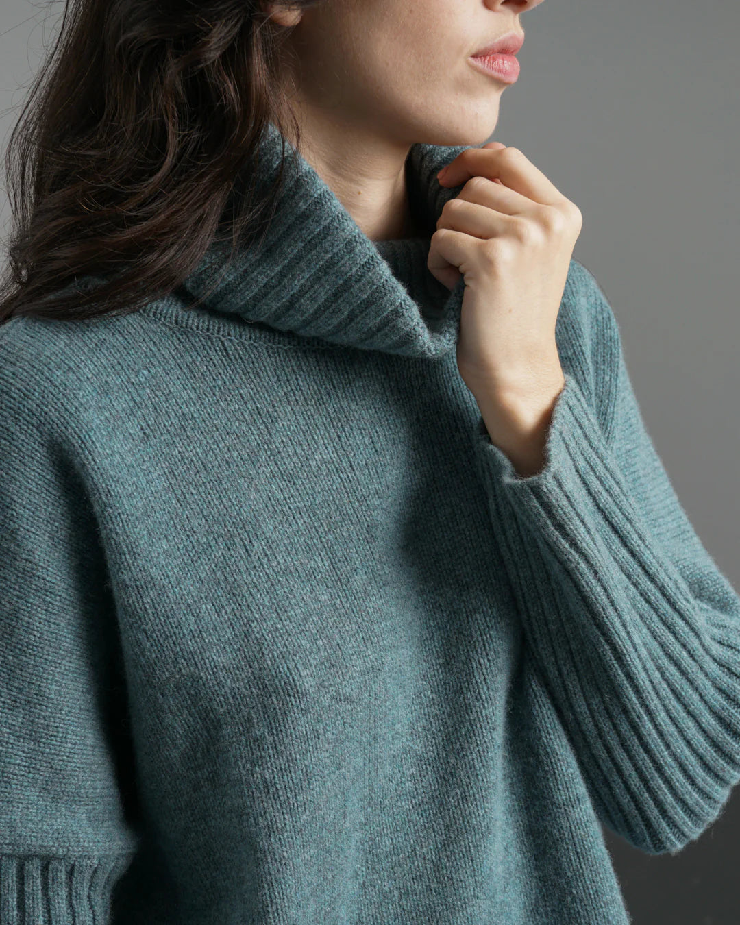 Woman wearing the Bibico Adela turtleneck woollen Jumper in Caspian