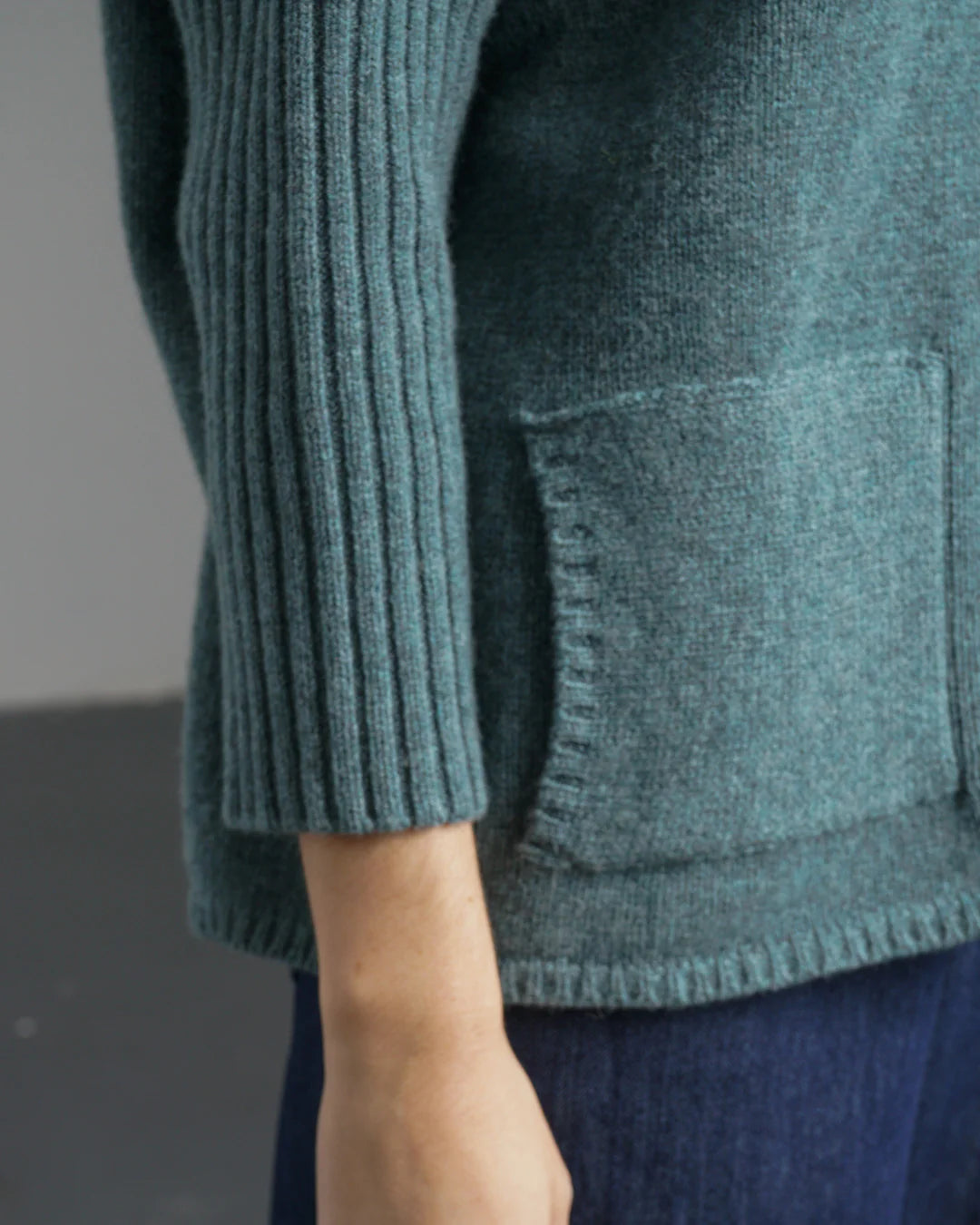 Woman wearing the Bibico Adela Jumper in Caspian blue with ribbed sleeves