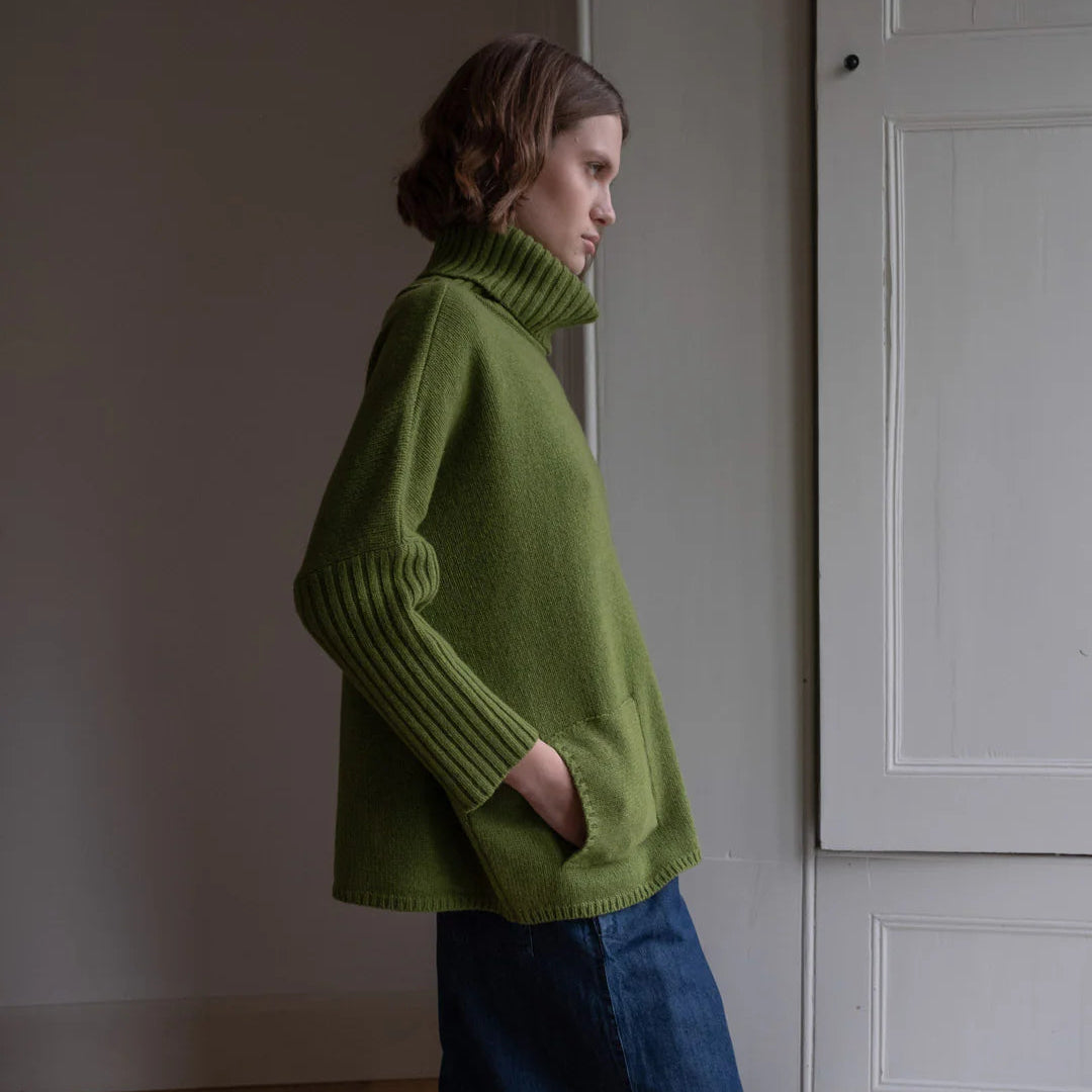 Woman wearing the Bibico turtleneck Jumper in Moss green