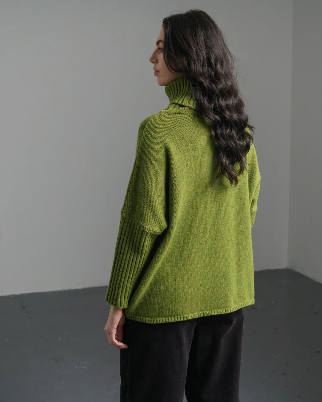 Woman wearing the Bibico Adela Jumper made with 100% wool in Moss