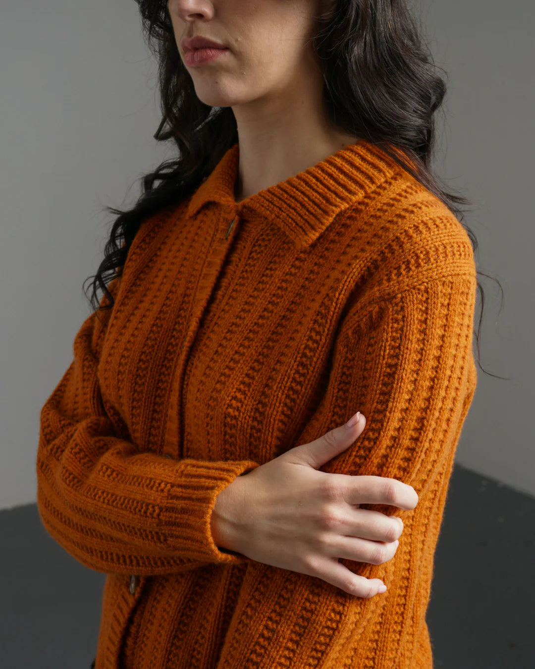 Quality Lambswool knitwear. Orange cardigan in a textured knit.