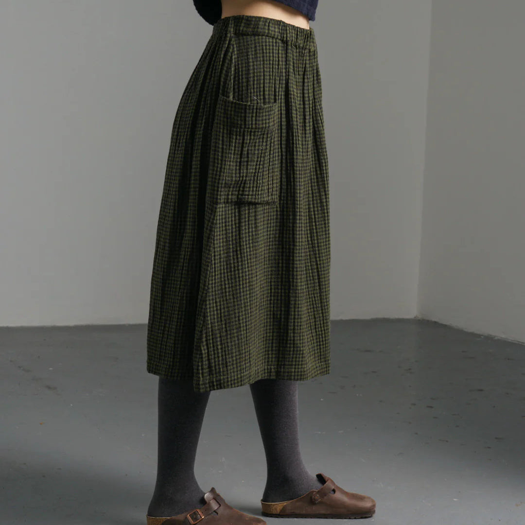 Woman wearing the Bibico Nora cotton winter Skirt in checked olive green