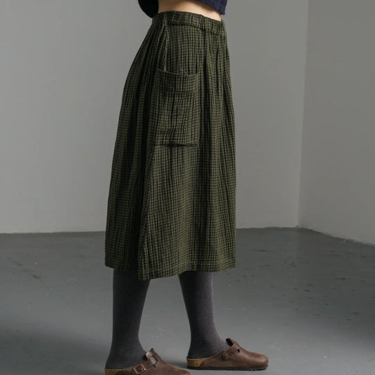 Woman wearing the Bibico Nora cotton winter Skirt in checked olive green