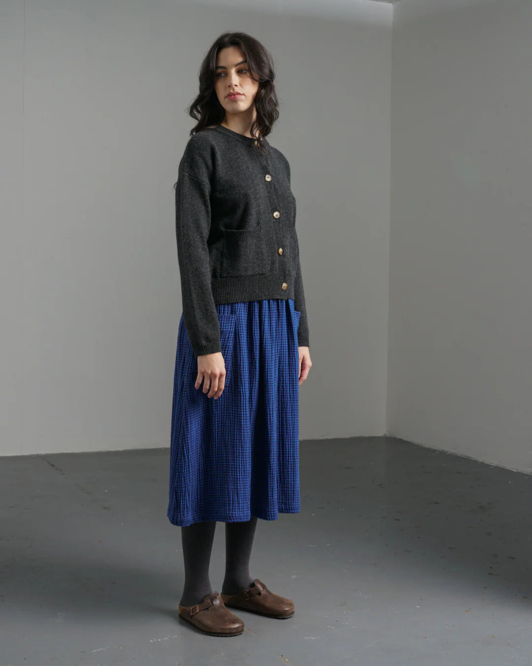 Woman wearing the Bibico Nora winter Skirt in checkered Petrol blue