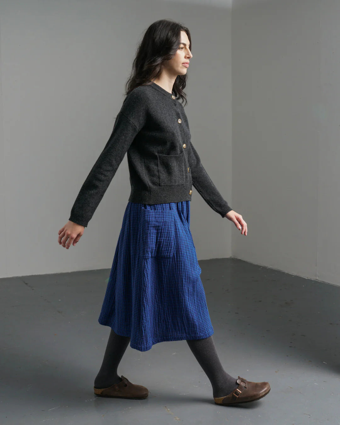 Woman wearing the Bibico Nora midi Skirt in checkered Petrol blue made with natural fibres