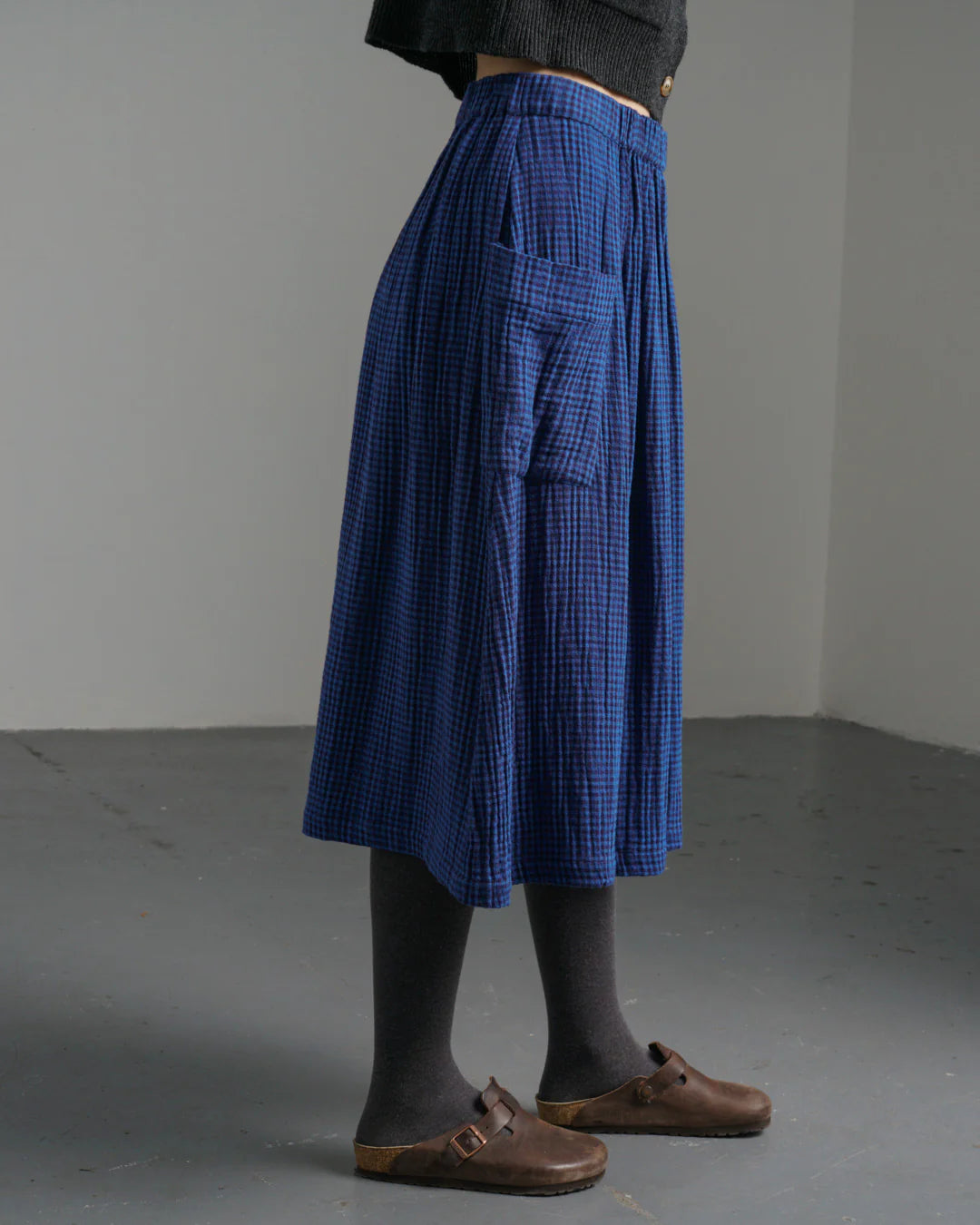 Woman wearing the Bibico Nora Skirt in Petrol plaid made wth cotton