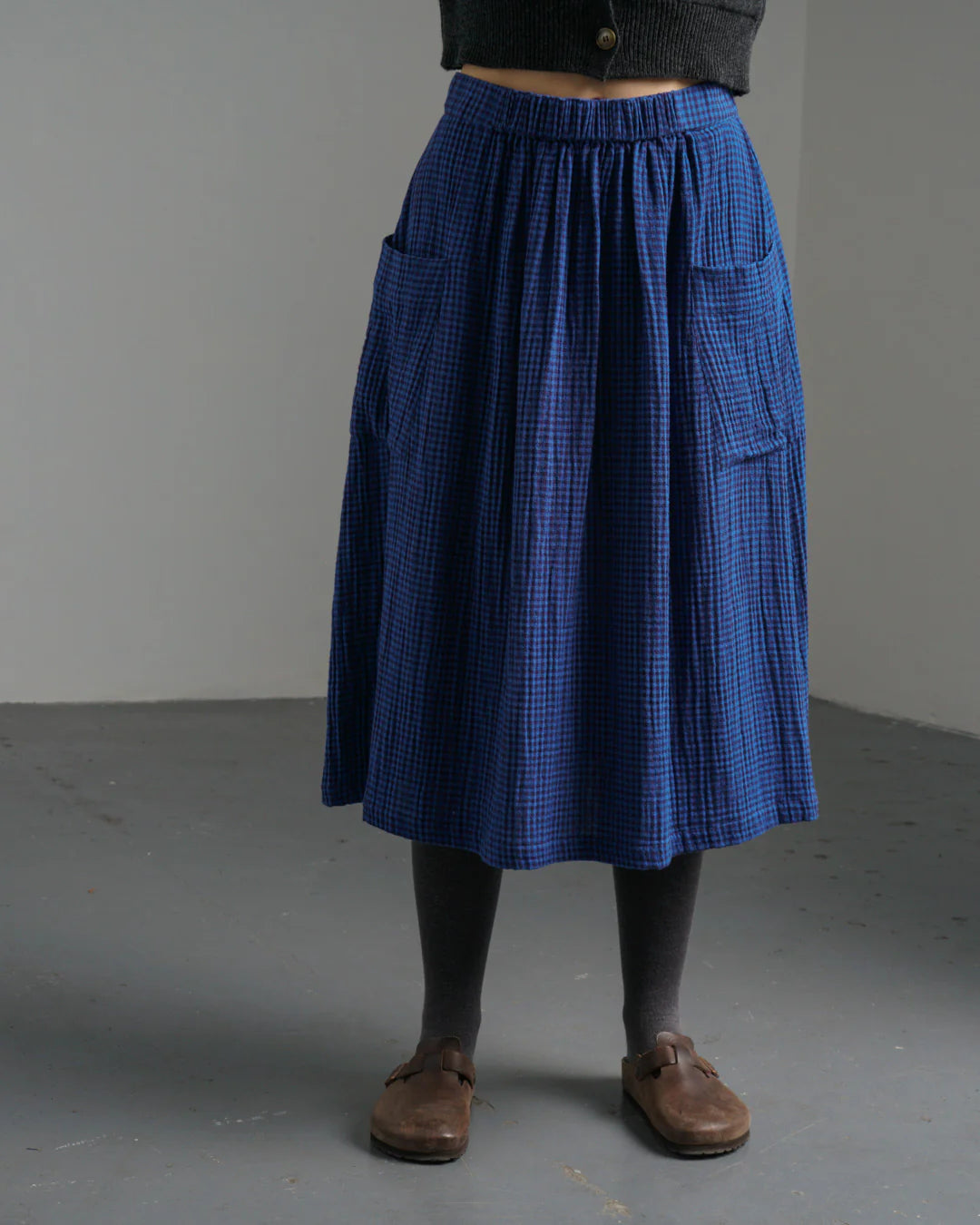 Woman wearing the Bibico Nora winter Skirt in Petrol plaid with pocket