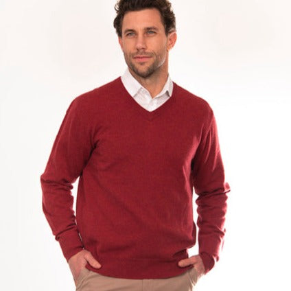 Mens red vee jumper in merino wool. Bridge and Lord.