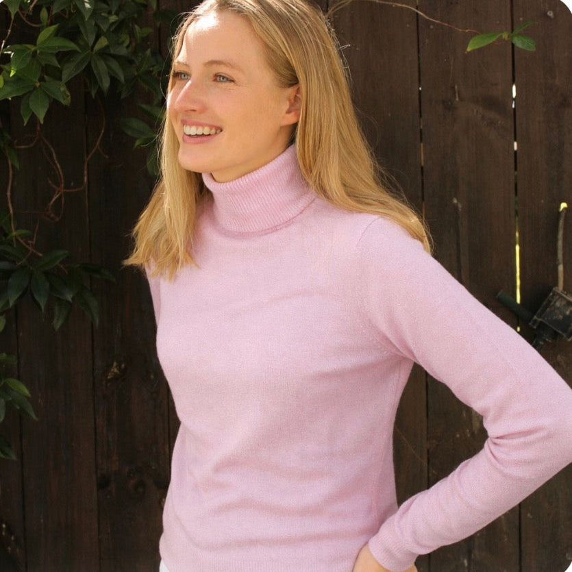 Bridge and lord roll neck jumper in pale pink.